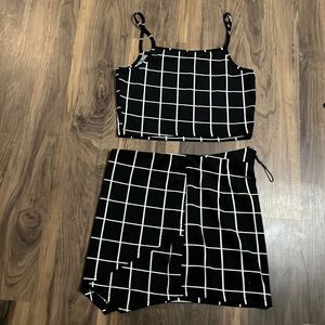Black two piece with white stripes (skirt has a zipper in back)